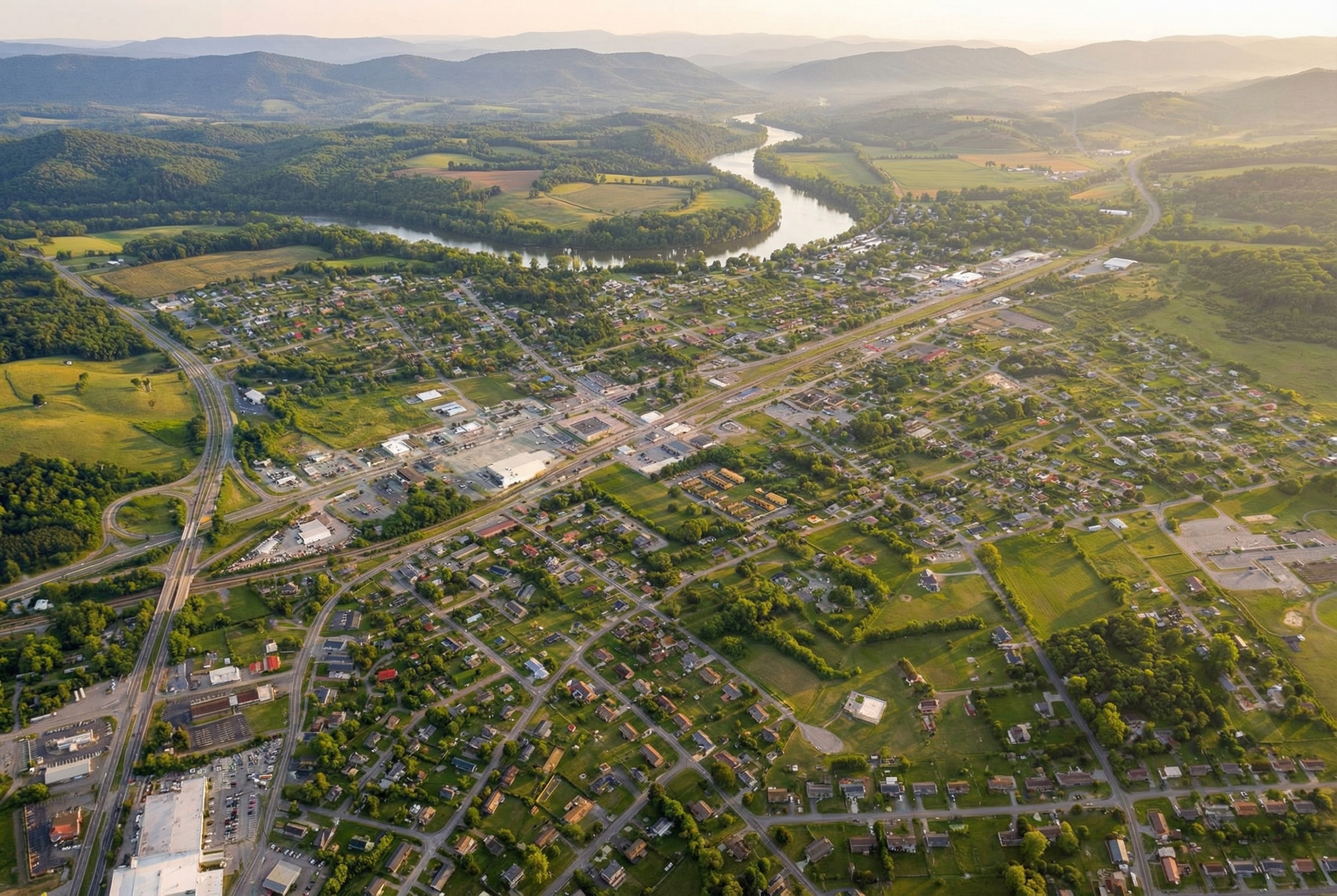 Wide view of Dublin neighborhoods, local roads, and low mountain ridges