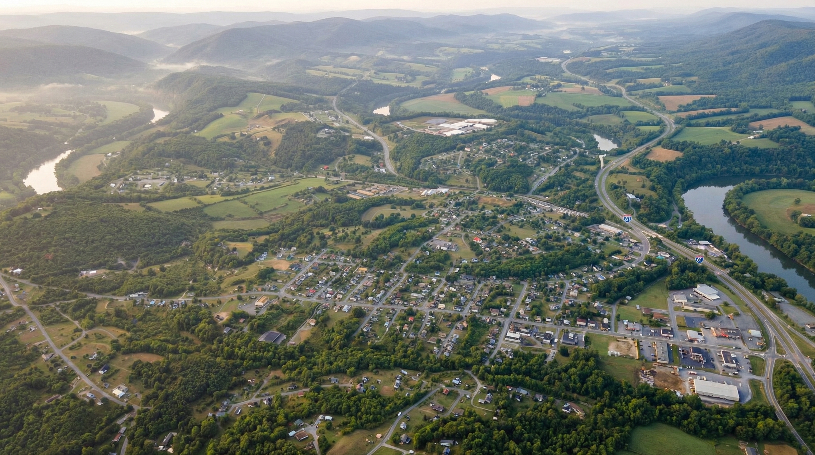 Wide view of Pulaski neighborhoods, mature trees, and surrounding hills