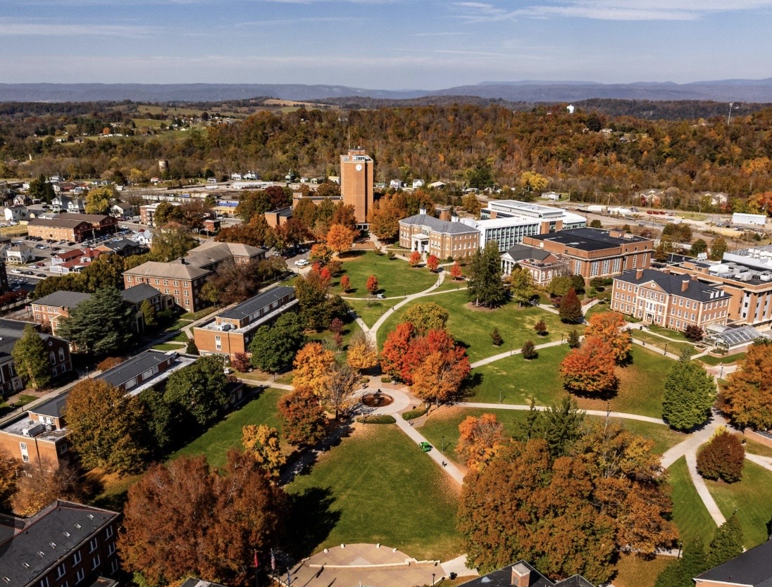 Wide view of Radford neighborhoods, tree-lined streets, and surrounding ridges